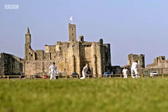 Warkworth Cricket Club in front of the castle, one of the progammes opening  scenes.