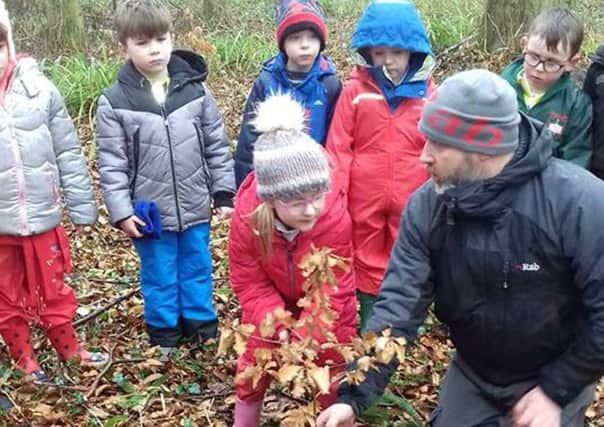 St Paul's pupils plant a tree in memory of Noreen Byrne.