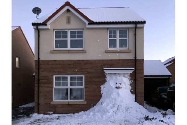 The snowman blocking Lee Swordy's house.