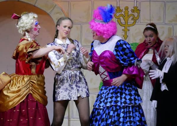 The Prince tries to keep Ugly sisters from bickering in Rothbury Pantomime Society's production of Cinderella. Picture by Duncan Elson