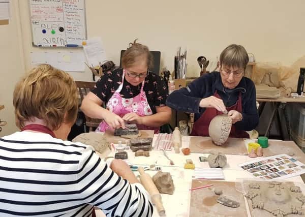 Potters at work at the First Time for Everything class.
