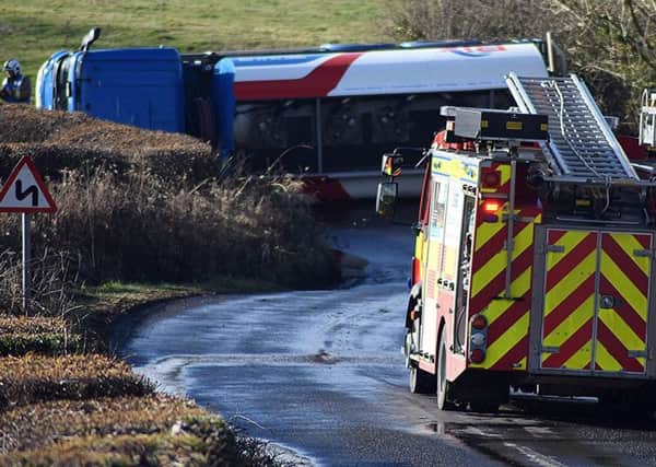 Emergency services at the overturned tanker. Picture by Steve Miller