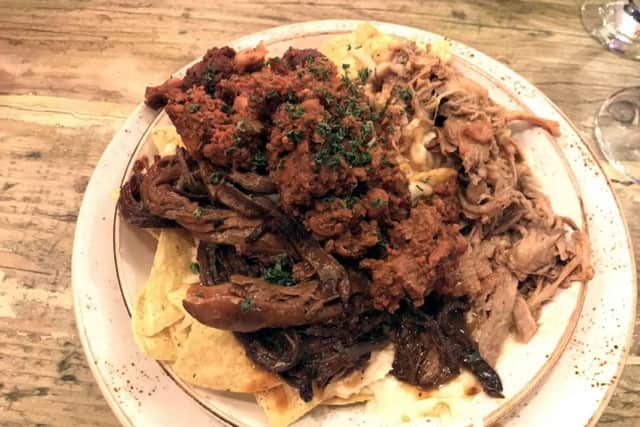 Meat nachos with mozzarella and topped with chilli, pulled pork and brisket starter at The Dirty Bottles, Narrowgate, Alnwick.