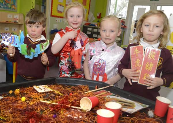 Ben, Naomi, Florence and Teddi celebrate Chinese New Year at Whittingham Primary School. Picture by Jane Coltman