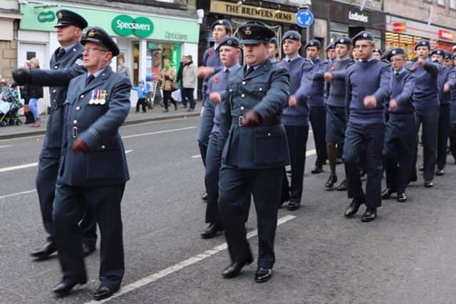 Flight Lieutenant Dave Gamlin leads the Air Cadets in a parade.