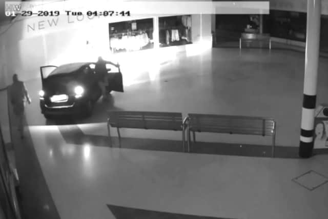 A still from the CCTV footage showing the thieves parked up in the shopping centre.