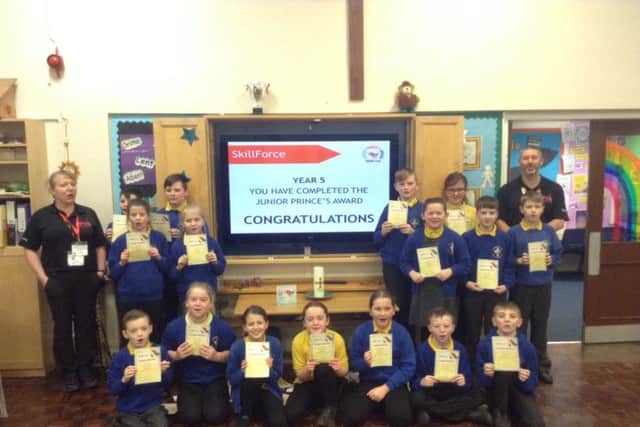 Year 5 Sea Dragons with their certificates.