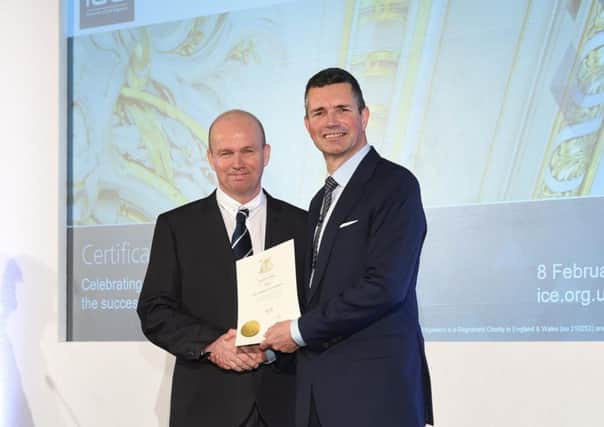 Kevin Miller receives his fellowship certificate from ICE President Andrew Wyllie.