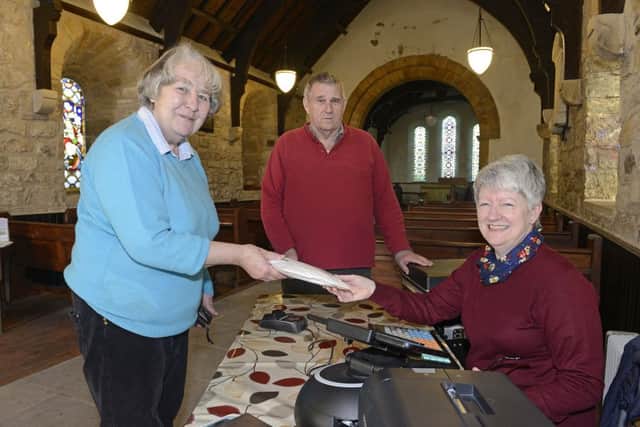 Sub postmistress Bessie Rogerson with customers Sue Burston and Keith Thompson. Picture by Jane Coltman