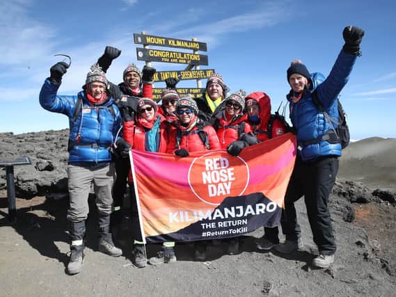 We've made it! The Kilimanjaro nine, including Rothbury's Alexander Armstrong, left, presenter of TV's Pointless, on the summit of Kilimanjaro. Picture by Chris Jackson / Getty for Comic Relief