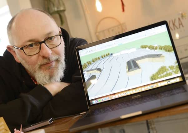 Mark Hobrough with the computer generated impression of the development at the former Duke's School site. Picture by Jane Coltman