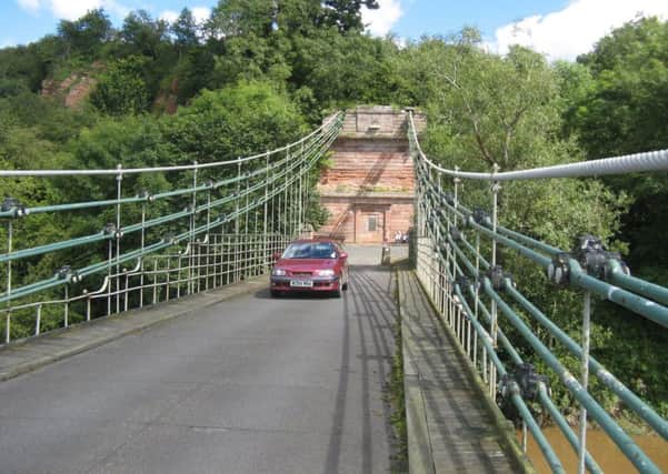 A car crossing the Union Chain Bridge linking Northumberland and Berwickshire, therefore England and Scotland. This is the oldest suspension bridge (1820) still open for traffic, a case for very slow driving.
Picture by John Wylde.