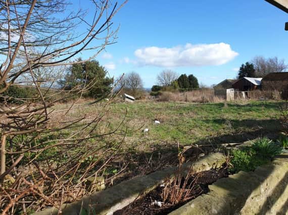 The site where three homes are proposed behind The Granby Inn in Longframlington.