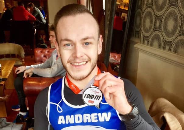 Andrew Fletcher with his Surrey Half-Marathon medal.