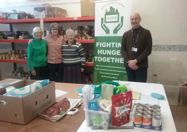 Alnwick Foodbank volunteers Jean Findlay, Marlene Gray, Carol McRoberts with NCC representative and the manager of Northumberland Adult Learning, based at Lindisfarne, Michael Holliday.