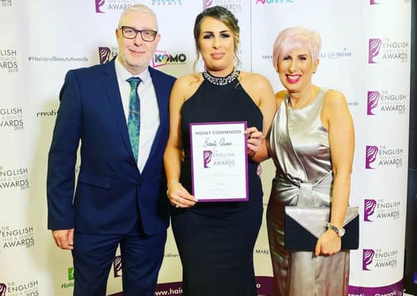 Beauty Queen's Kay Harding with her highly commended certificate at the English Hair and Beauty Awards.