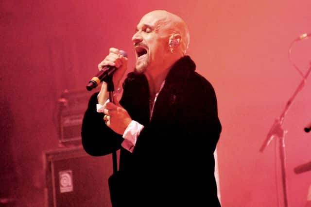 Tim Booth proving he won't stand for sitting down. Photo by Carl Chambers
