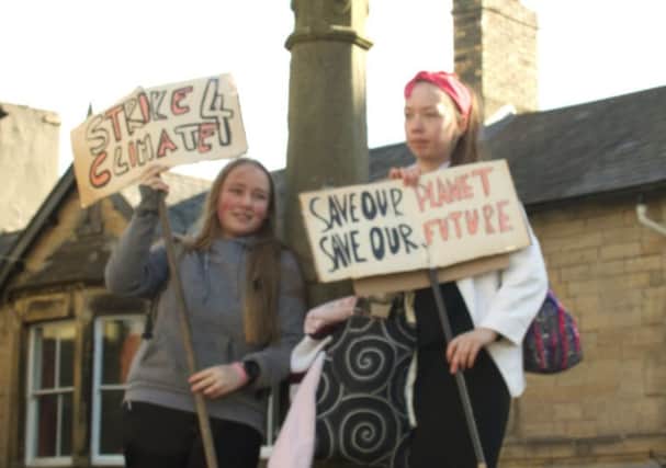 Daisy Carnegie and Samantha Scott, both in Year 9 at Duchess's Community High School make a Strike4Climate protest in Alnwick.