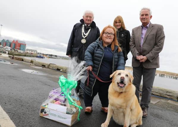 Ward councillor and civic head  Jeff Watson, enforcement officer Andrea Cowens, Coun Glen Sanderson, cabinet member for local services and the environment, with 2,000th Green Dog Walker Beverley Beers and her dog Jess. Picture by Helen Smith