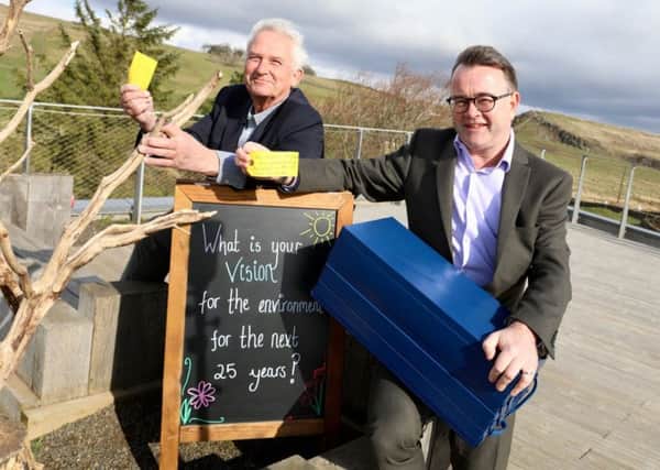 Chairman of Northumberland National Park, Coun Glen Sanderson and chief executive Tony Gates with the time capsule that is to be buried at The Sill.