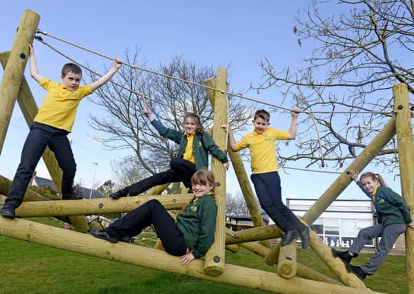 Youngsters at Warkworth Primary School enjoying their new play equipment. Picture by Jane Coltman