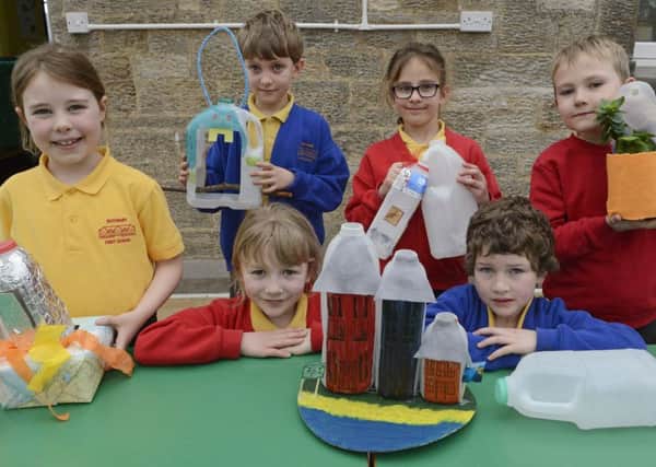 Pupils at Rothbury First School with their clever plastic recycling ideas. Picture by Jane Coltman