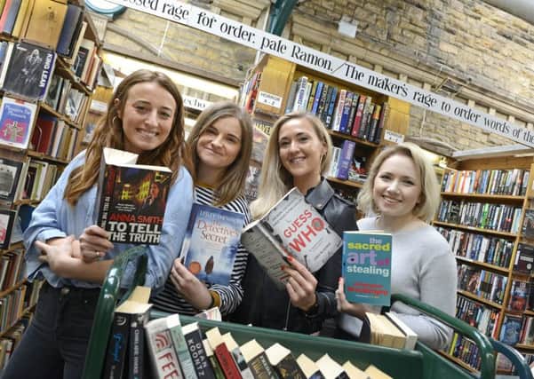 Charlotte Jacobs, Kathryn Burke, Harriet Ryder and Brittany Borkan from The Heist doing a bit of research is the crime department of Barter Books. Picture by Jane Coltman