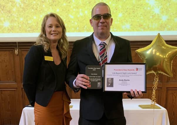 Andy Bache with his award and certificate, alongside Nicky Shaw, operations director at Blind Veterans UK.