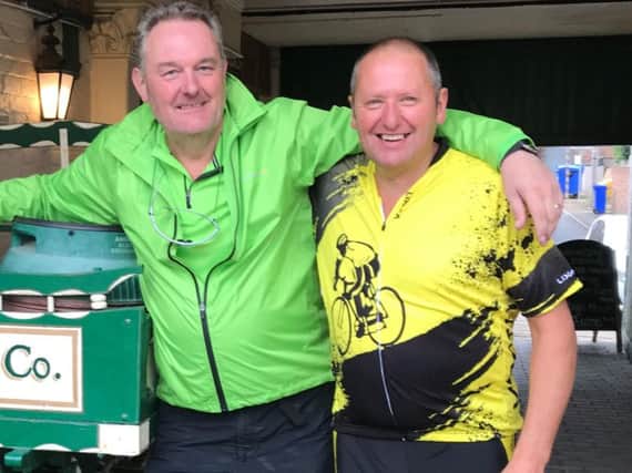 Graeme Bruce, left, and fellow cyclist Ian Davison.