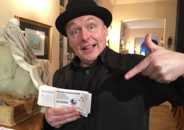Parade director Richard Broderick with the first Whitley Bay Carnival raffle tickets  on sale at participating venues in the town.