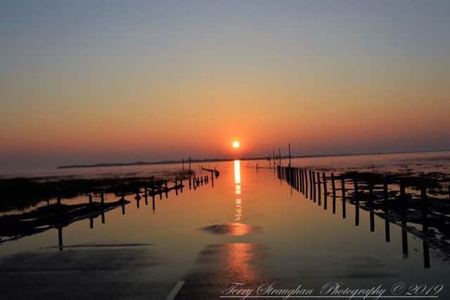 What a scene to wake up to. Terry Straughan's view of sunrise over Holy Island causeway. 459 Facebook likes