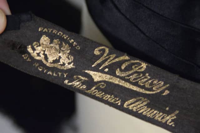 The label on a jacket made at the Louvre, Alnwick, by William Percy's dressmaking company.
