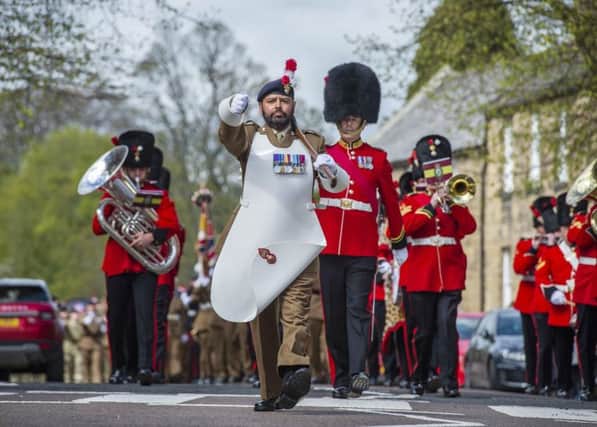 The Pioneer Sergeant with his distinctive beard and silver axe leads the parade. Picture by Sgt Donald Todd RLC