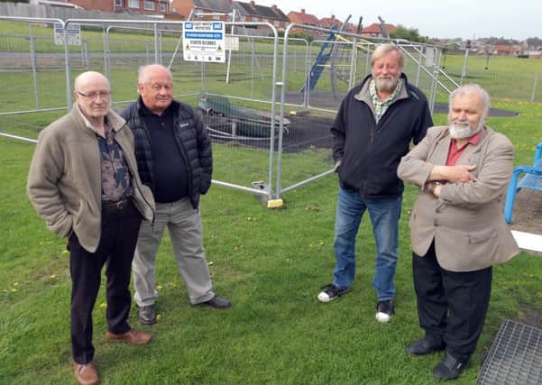 East Bedlington Parish Councillors John Batey,  Alex Wallace,  Allan Stewart, and Paul Hedley in the vandalised play area. Picture by Jane Coltman