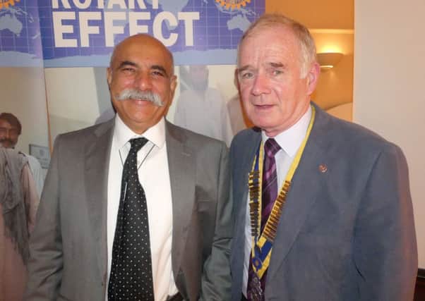 Dr Amjad Gulzar Shaikh and Morpeth Rotary President Bob Kendall.