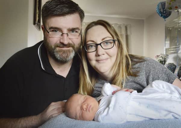 Graeme Knox and Louise Eamens with their son Harrison James. Picture by Jane Coltman