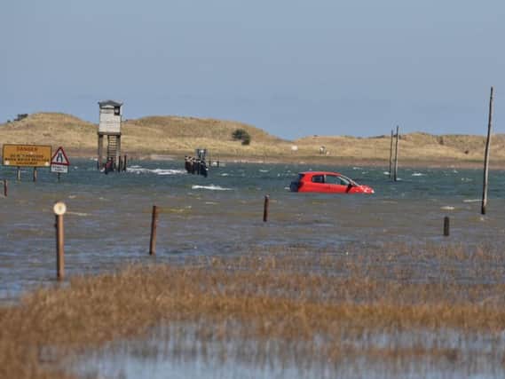 The car on the causeway. Picture by Dave Siggens