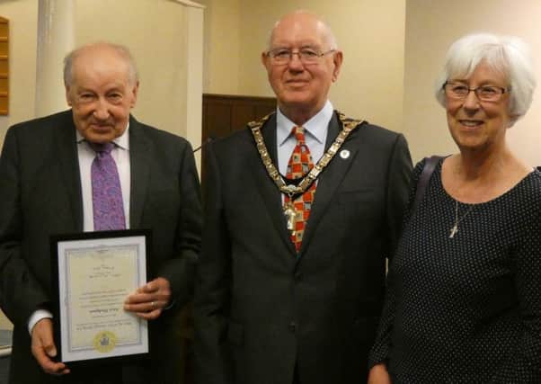 Mayor Alan Symmonds
 presents awards to Alan Hodgson and Jean Darby.