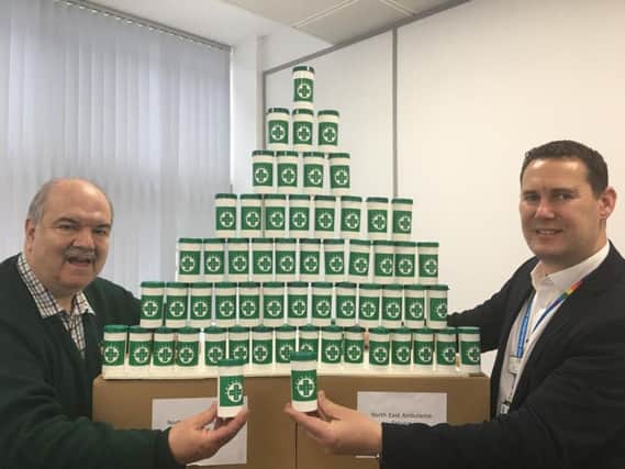 Adrian Lazenby from the Lions Clubs International in the North East handed over 1,000 bottles to Mark Johns, the head of engagement and diversity at NEAS.