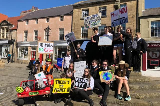 Alnwick YouthStrike4Climate students gather in the Market Place.