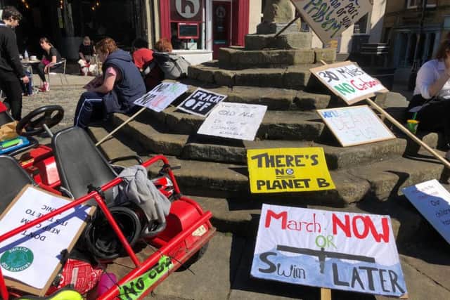 Placards from the Alnwick YouthStrike4Climate march in Alnwick Market Place on Friday, May 24.