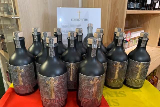 Bottles of Alnmouth Gin in the Taste of Northumbria shop in Alnwick Market Place.
