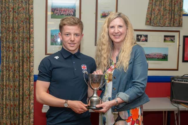 Morpeth Mayor Alison Byard presents Daniel Dixon with his award. Picture by Darren Turner.