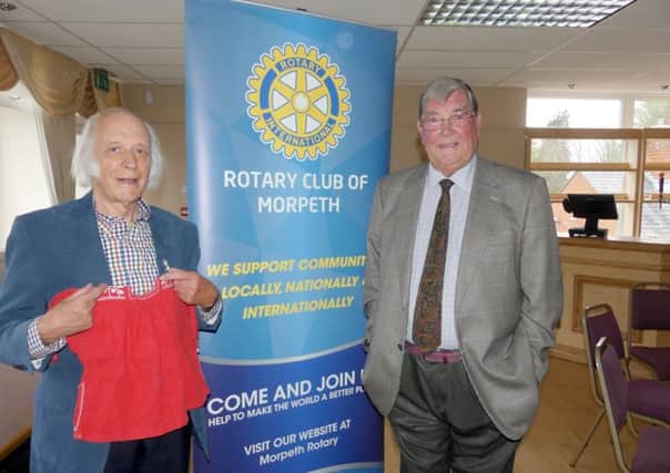 Otto Meth-Cohn with the red smock he wore on the train from Germany and with Rotarian Derek Robinson.