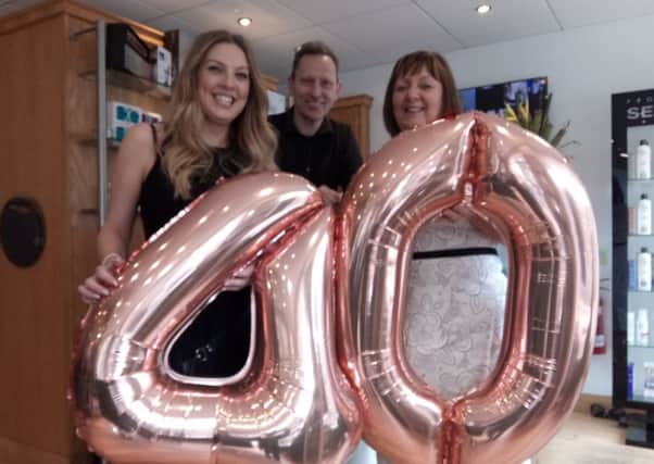Jamie Bellizzi, left, Russell Fleming and Janice Dale pictured during the celebration in the salon last Thursday.