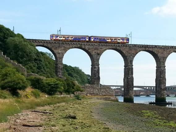 A train crossing the Royal Border Bridge in Berwick.