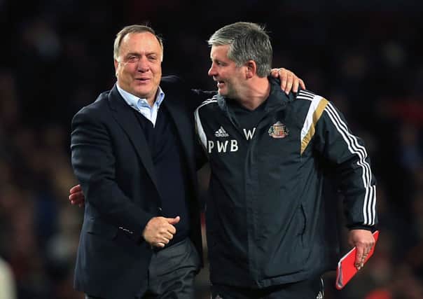 Sunderland manager Dick Advocaat (left) and Paul Bracewell (right) after the Barclays Premier League match at the Emirates Stadium, London. PRESS ASSOCIATION Photo. Picture date: Wednesday May 20, 2015. See PA story SOCCER Arsenal. Photo credit should read: Mike Egerton/PA Wire. RESTRICTIONS: Editorial use only. Maximum 45 images during a match. No video emulation or promotion as 'live'. No use in games, competitions, merchandise, betting or single club/player services. No use with unofficial audio, video, data, fixtures or club/league logos.