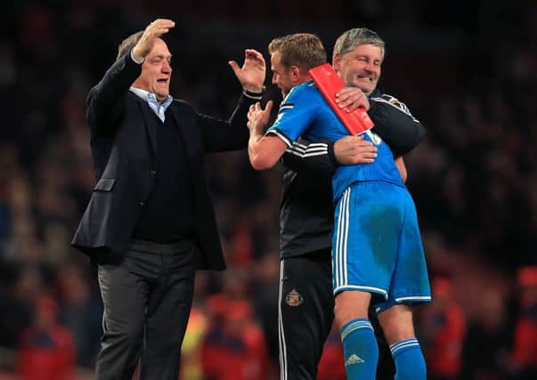 Sunderland manager Dick Advocaat (left) will not playr Lee Cattermole (right) at Chelsea