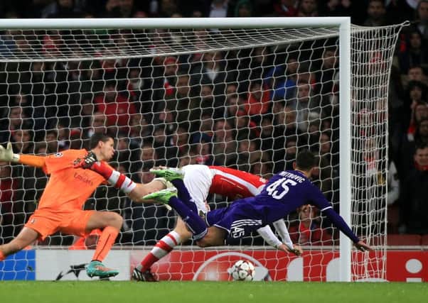 Anderlecht's Aleksandar Mitrovic scores his side's third goal of the game during the UEFA Champions League Group D match at Emirates Stadium, London. PRESS ASSOCIATION Photo. Picture date: Tuesday November 4, 2014. See PA story SOCCER Arsenal. Photo credit should read Nick Potts/PA Wire.