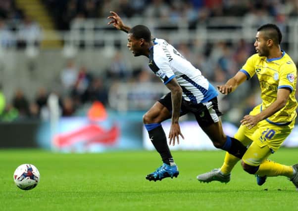 Newcastle's Georginio Wijnaldum tries to get away from Lewis McGugan of Sheffield Wednesday